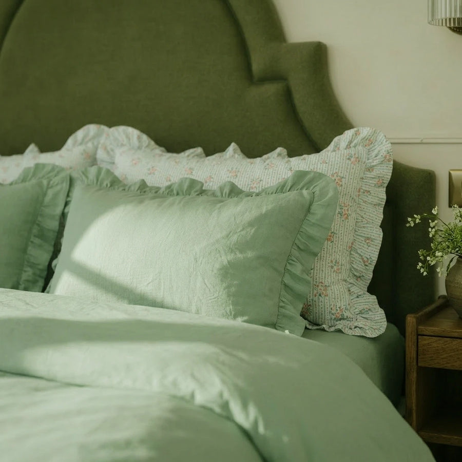 sage green ruffle trim pillowcase macro detail