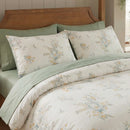 matching floral pillow shams in cotton cream and sage green reversible bedding detail