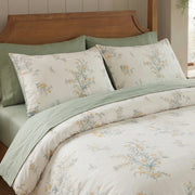 matching floral pillow shams in cotton cream and sage green reversible bedding detail