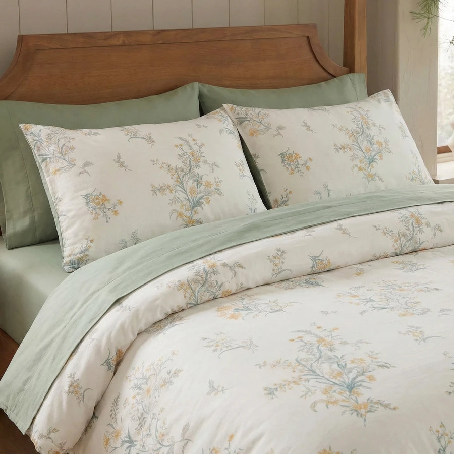 matching floral pillow shams in cotton cream and sage green reversible bedding detail
