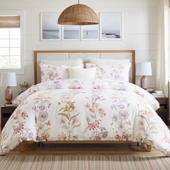 Full view of the floral comforter set in a bedroom with natural light
