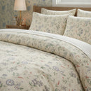 secret garden sprig duvet cover set styled on bed with white wooden headboard in a bright room