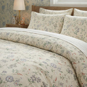 secret garden sprig duvet cover set styled on bed with white wooden headboard in a bright room