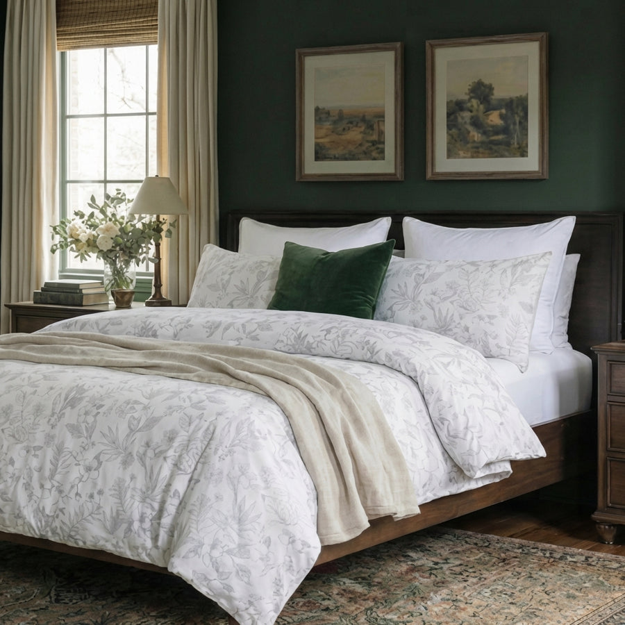 minimalist grey and white botanical bedding set in a bright airy room with rustic wooden bed