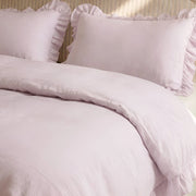 soft lilac ruffled pillow shams linen texture close up