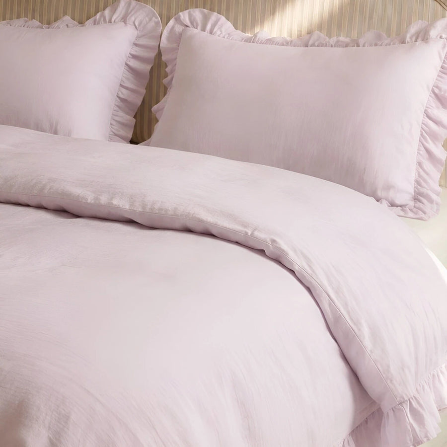 soft lilac ruffled pillow shams linen texture close up