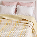 solace yarn dyed quilt butter solace white ruffled pink pillows headboard