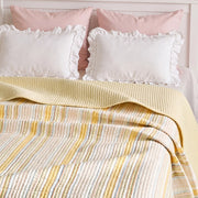 solace yarn dyed quilt butter solace white ruffled pink pillows headboard