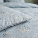sprigged blue duvet cover fabric detail botanical print close up