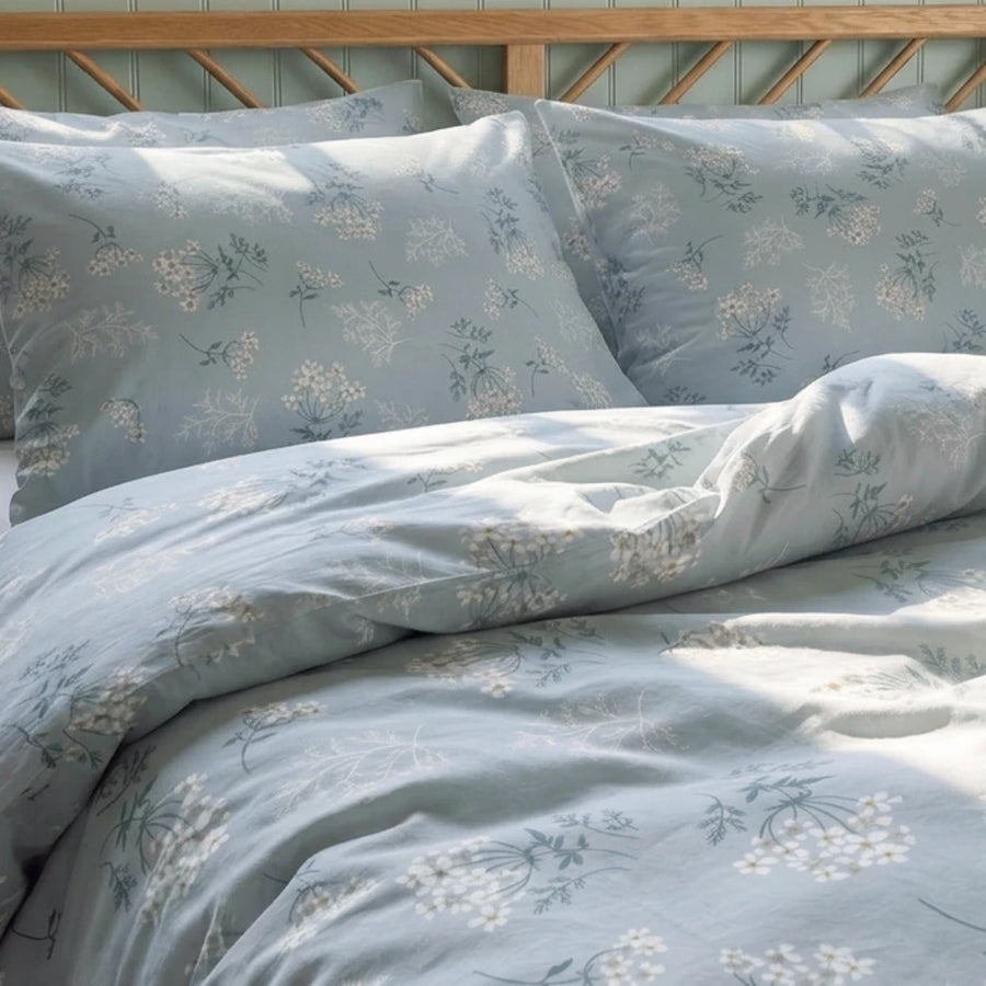 sprigged blue floral bedding set matching pillow shams close view