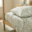 stacked enchanted spring botanical pillowcases and flat sheet