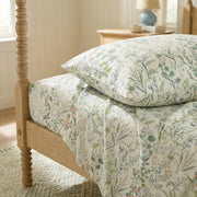 stacked enchanted spring botanical pillowcases and flat sheet