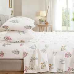 Stacked cotton wildflower print pillows and fitted sheet set close up detail