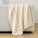 sunday patchwork muslin blanket strawberry pink red trim cream sofa drape