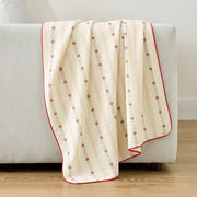sunday patchwork muslin blanket strawberry pink red trim cream sofa drape