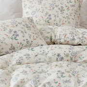 overhead shot of sunlight petal drift cotton bedding arrangement for a cozy home aesthetic