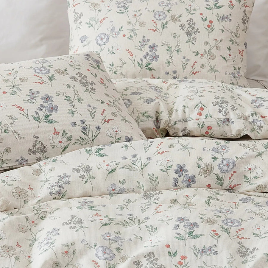 overhead shot of sunlight petal drift cotton bedding arrangement for a cozy home aesthetic