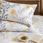 sunlit grey yellow botanical bedding set layered look