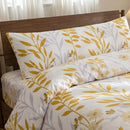 sunlit grey yellow shams close up shabby chic