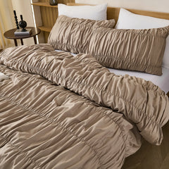 Taupe crinkle cotton comforter headboard closeup