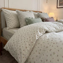 tiny blossom duvet cover set wooden bed cozy bedroom scene