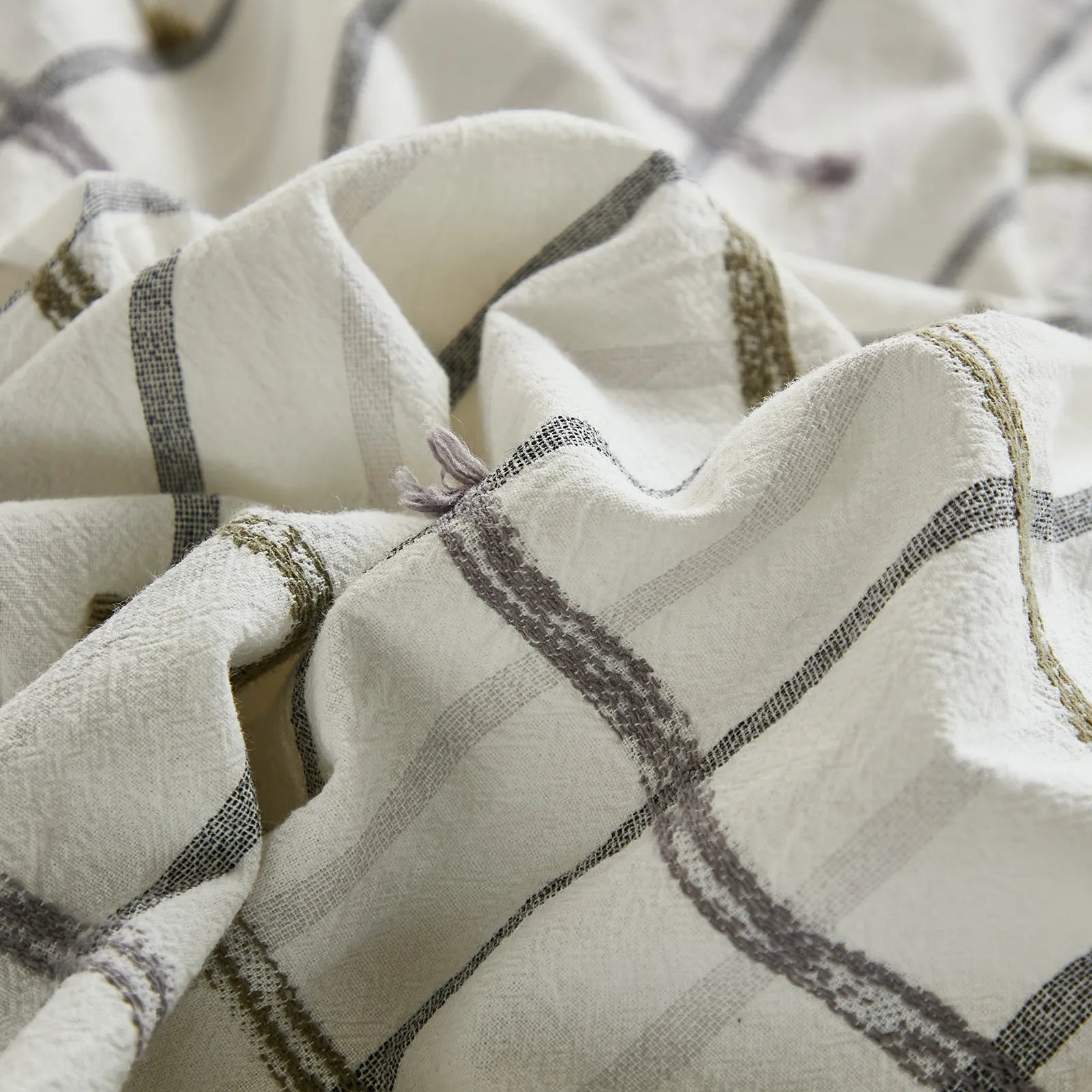 Close up detail of tufted grid cotton fabric