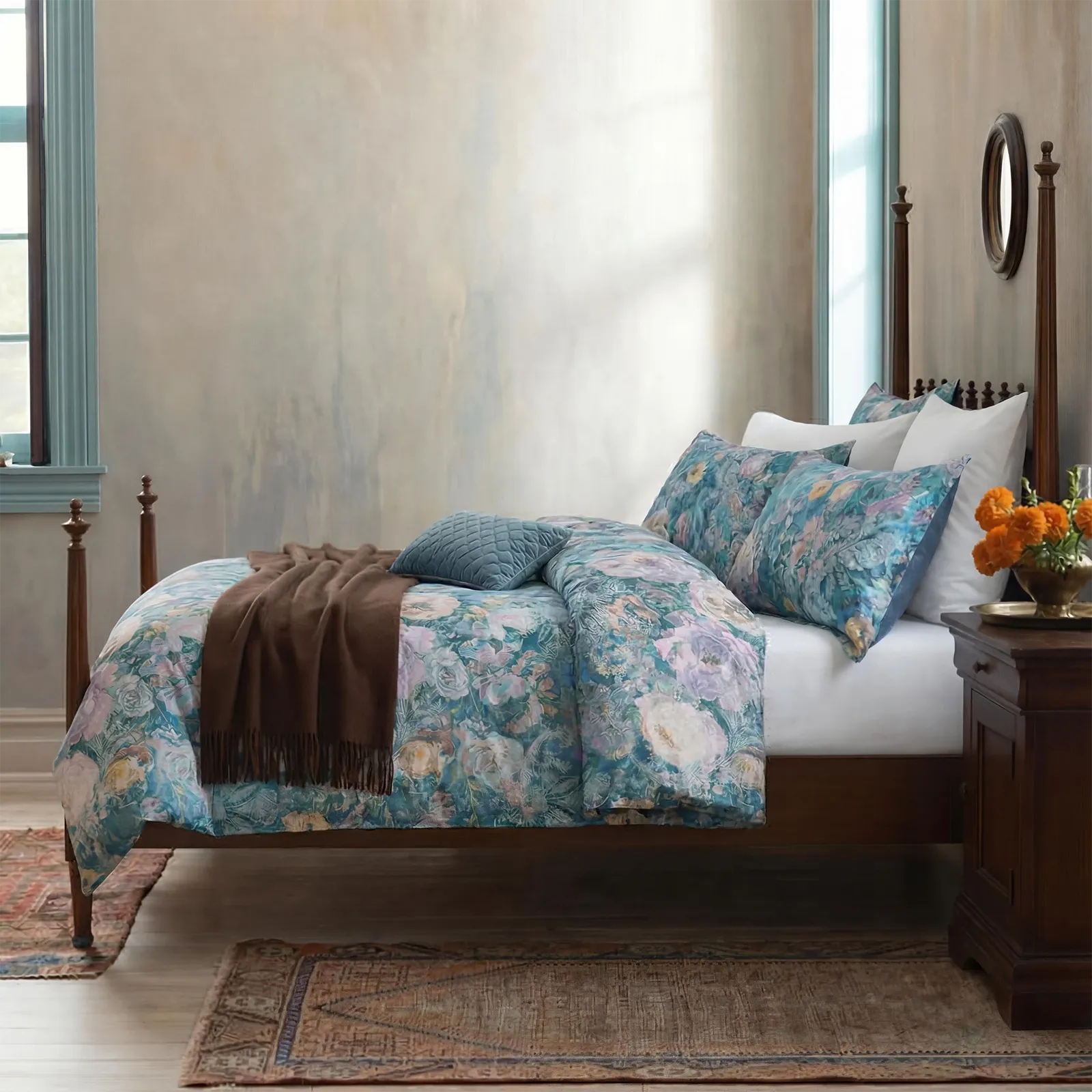 Vintage blue floral duvet cover on a wooden four-poster bed
