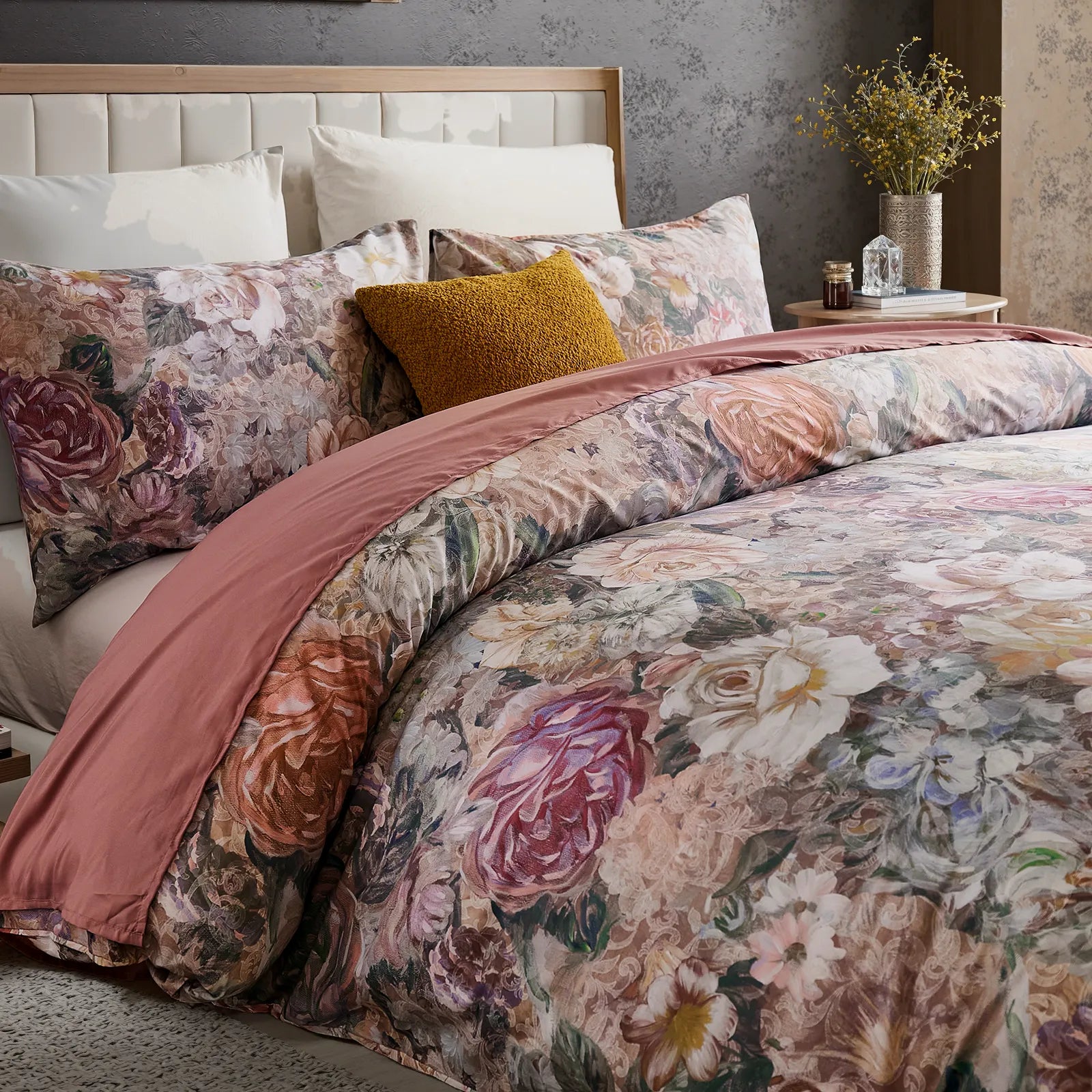 Closeup of vintage floral pattern showing pink white and purple cotton blossoms