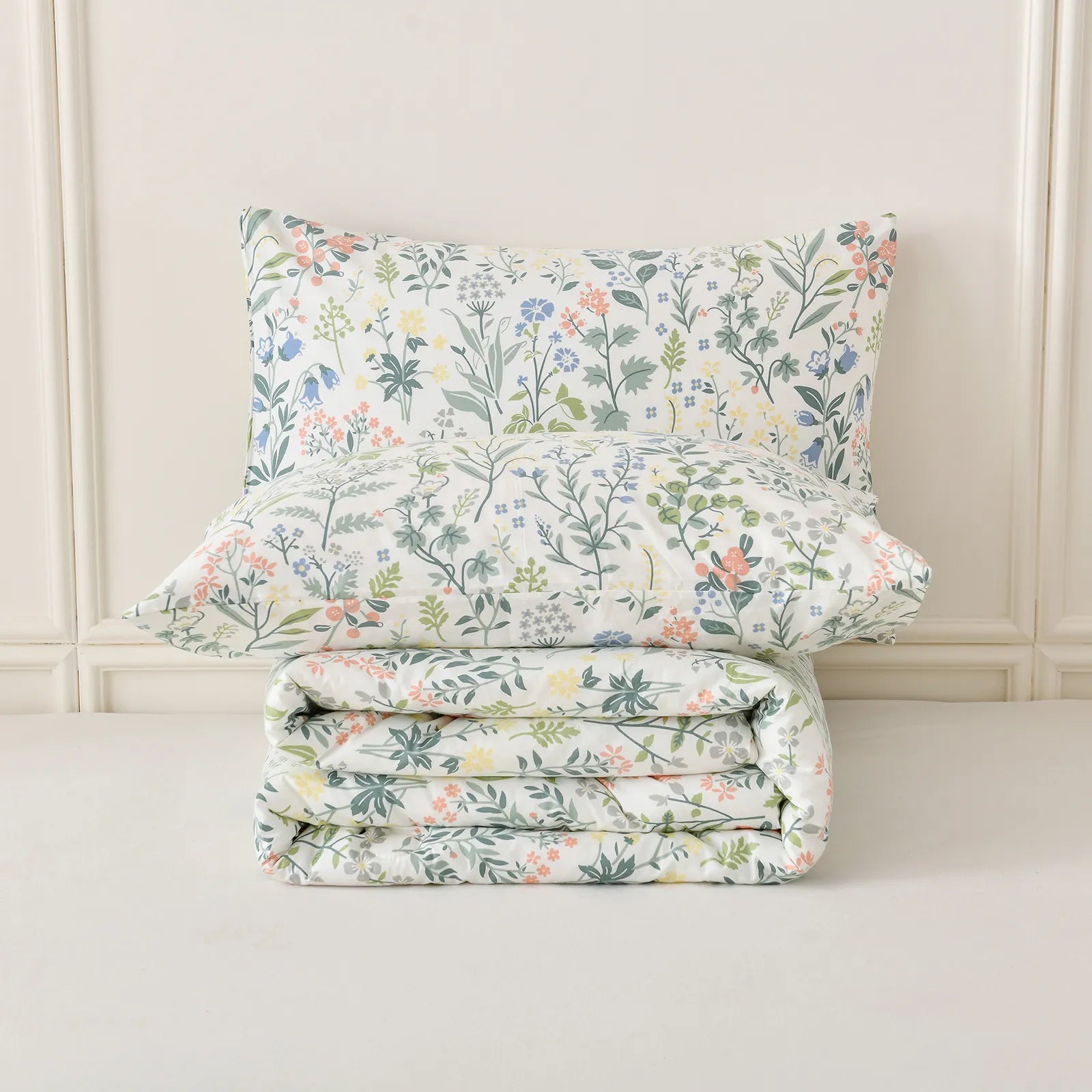 A detailed shot of a folded 100% Cotton Vintage Green Floral comfort set.