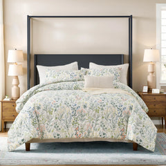 Full view of the vintage green floral duvet cover set on a bed