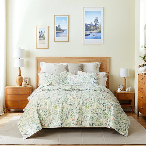A full view of the vintage green floral quilt set on a bed, perfect for a cozy bedroom.
