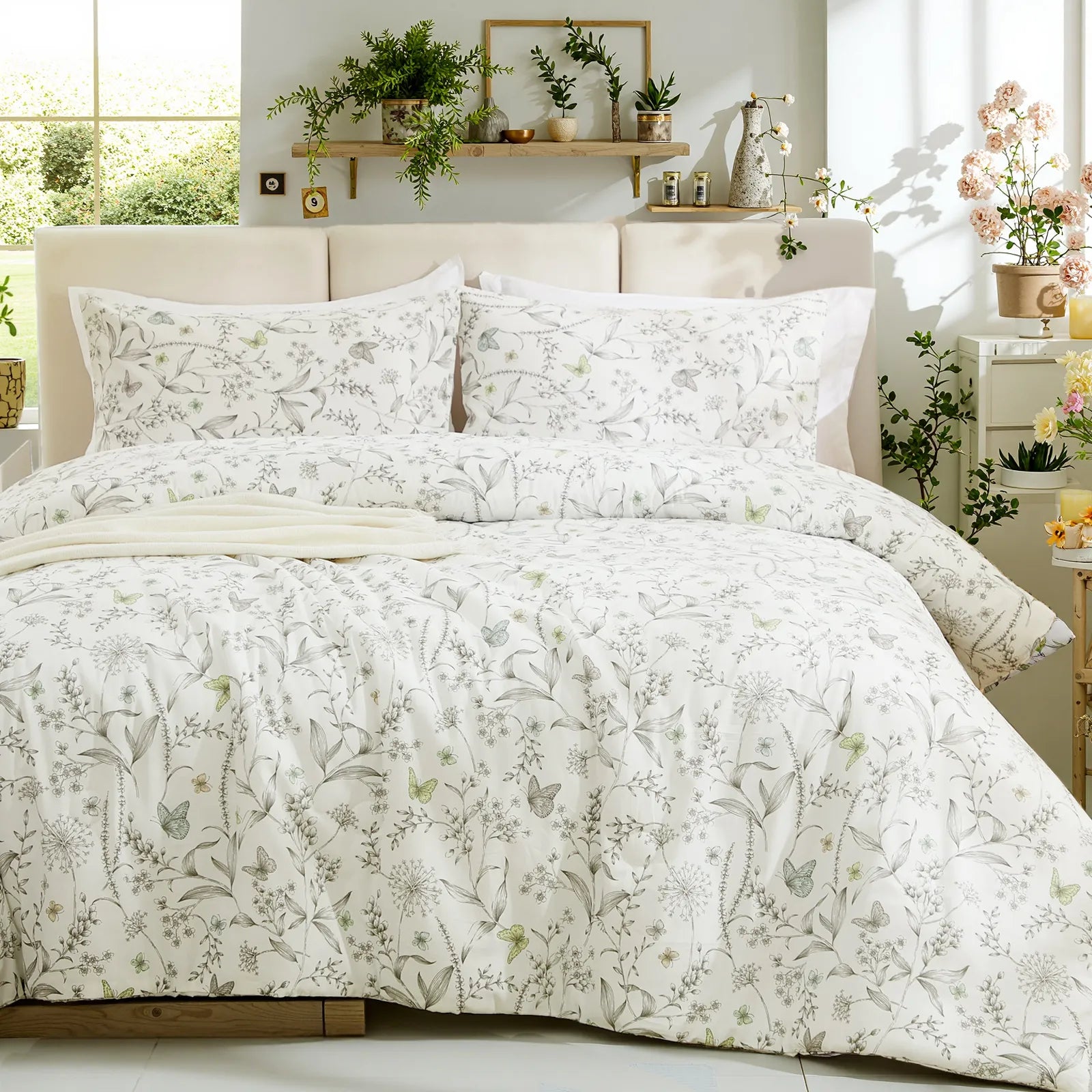 Full view of the vintage grey floral duvet cover set styled in a cozy, bright bedroom