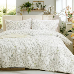 Full view of the vintage grey floral duvet cover set styled in a cozy, bright bedroom