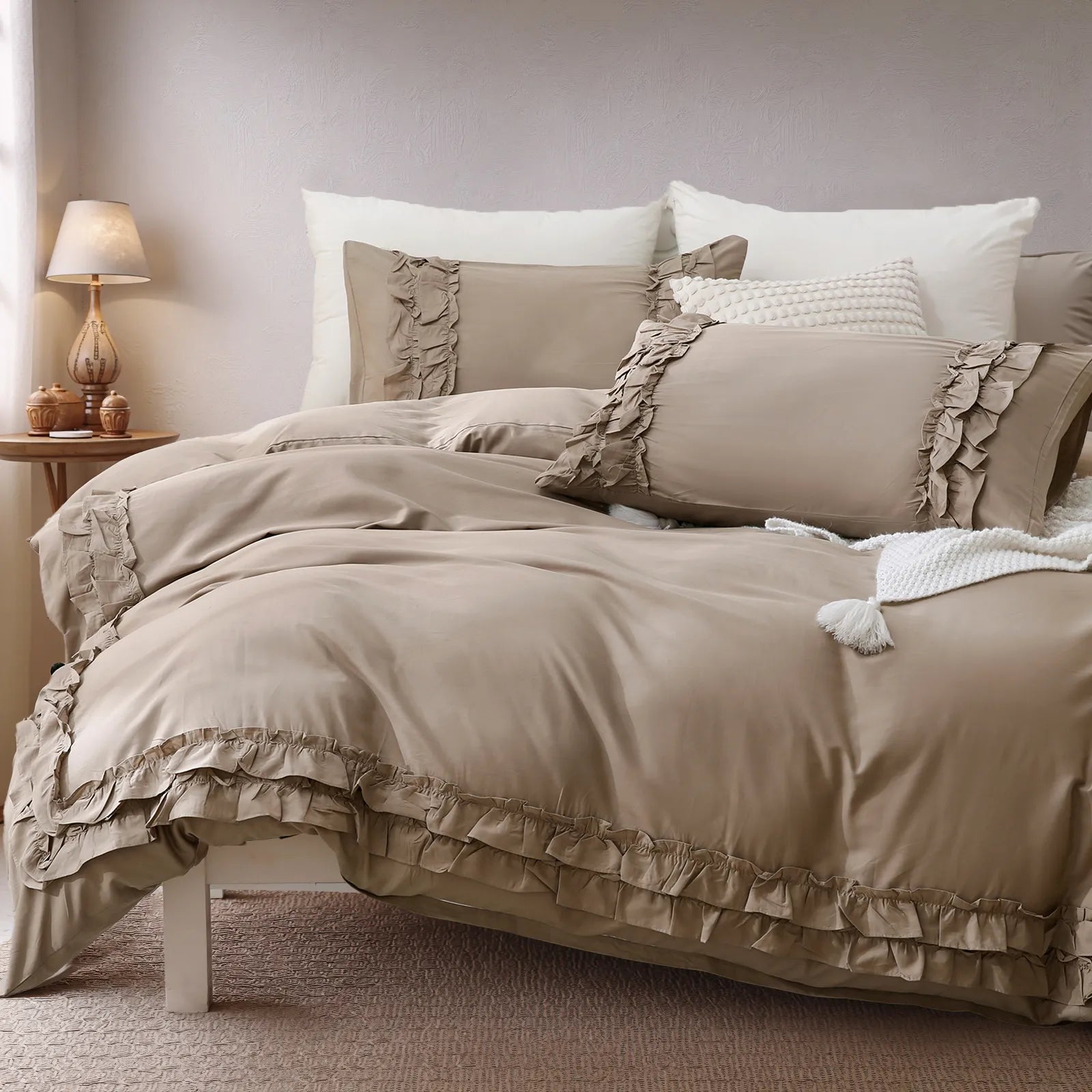 Angled view of the warm greige comforter set showing the full bed and pillows