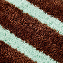 wave rider rug cocoa mint striped tufted texture closeup