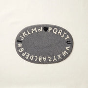 whimsy garden rug abc grey flat lay product photo