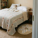 whimsy garden rug lily on sand bedroom styling