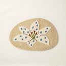 whimsy garden rug lily on sand flat lay product photo