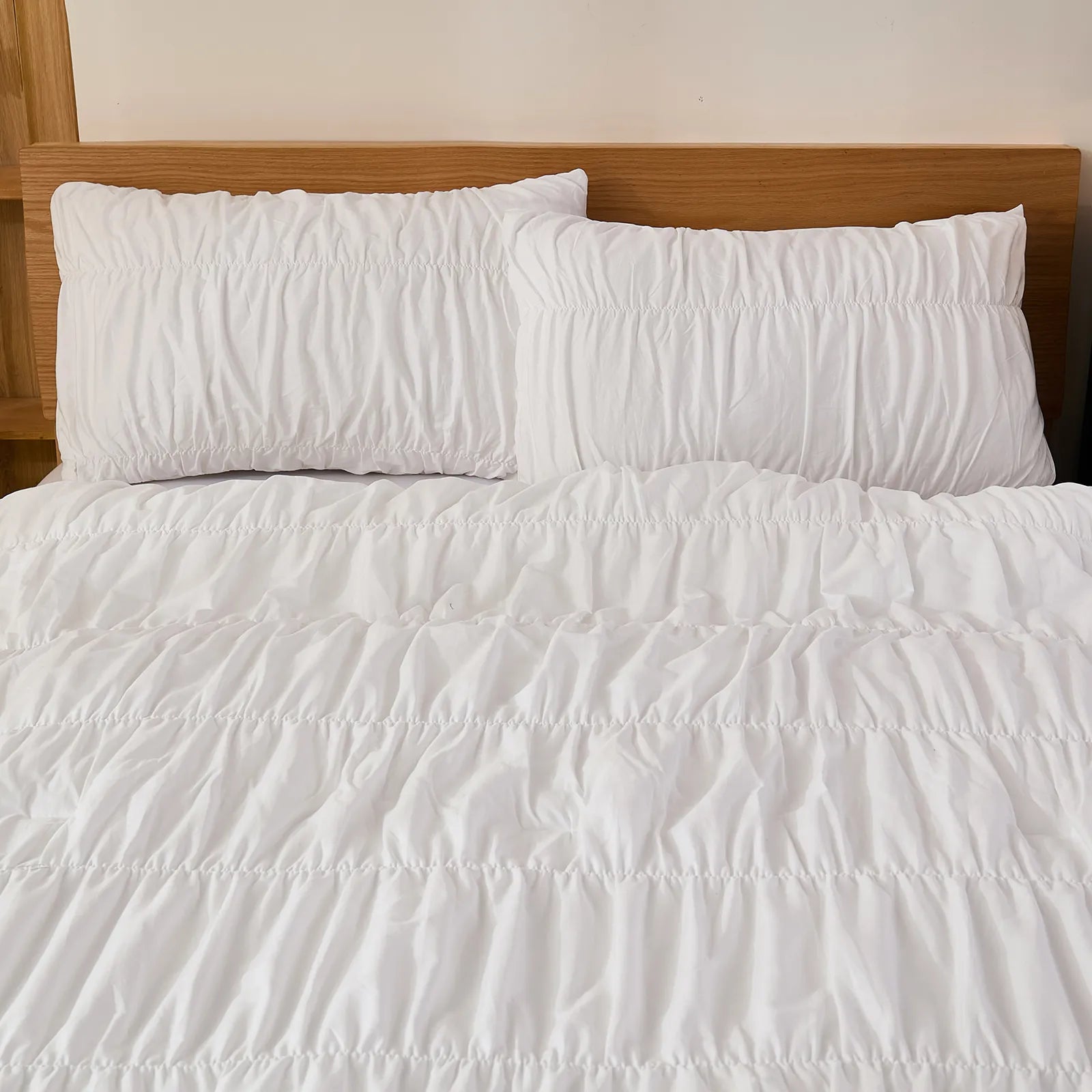 White ruffle cotton comforter headboard closeup