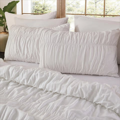 White ruffle cotton comforter window side view