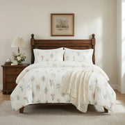 wildflower meadow duvet cover set styled on bed with wooden headboard rustic bedroom