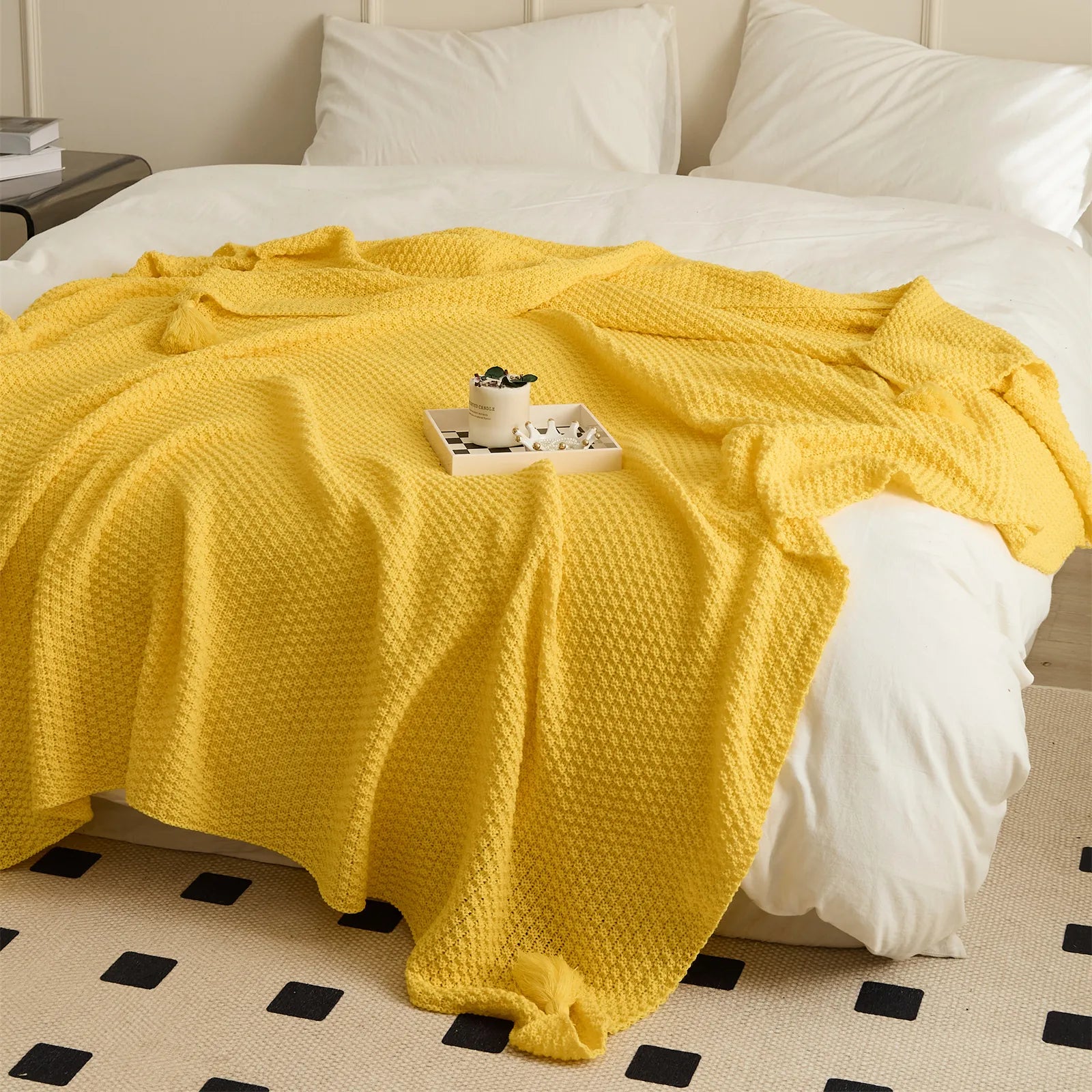Bright Yellow Knitted Throw Blanket Draped on Bed with Tray Decor